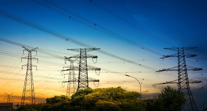 sun setting behind the silhouette of electricity pylons 1127 2986 उत्तर प्रदेश: निकाय चुनाव खत्म होते ही लोगों को लगा बिजली का झटका, सरकार ने बढ़ाए दाम